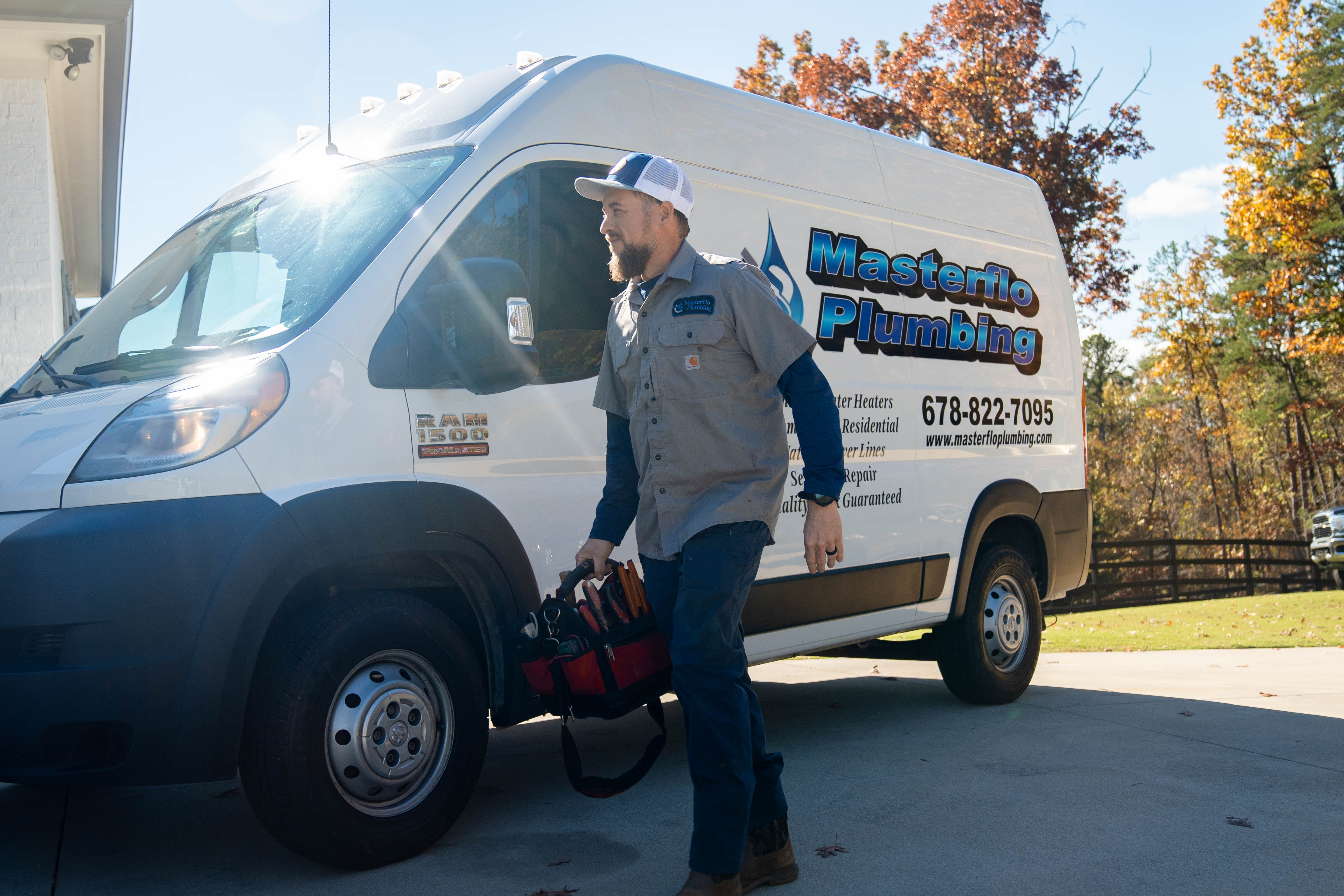 MasterFlo Plumbing service technician and work van
